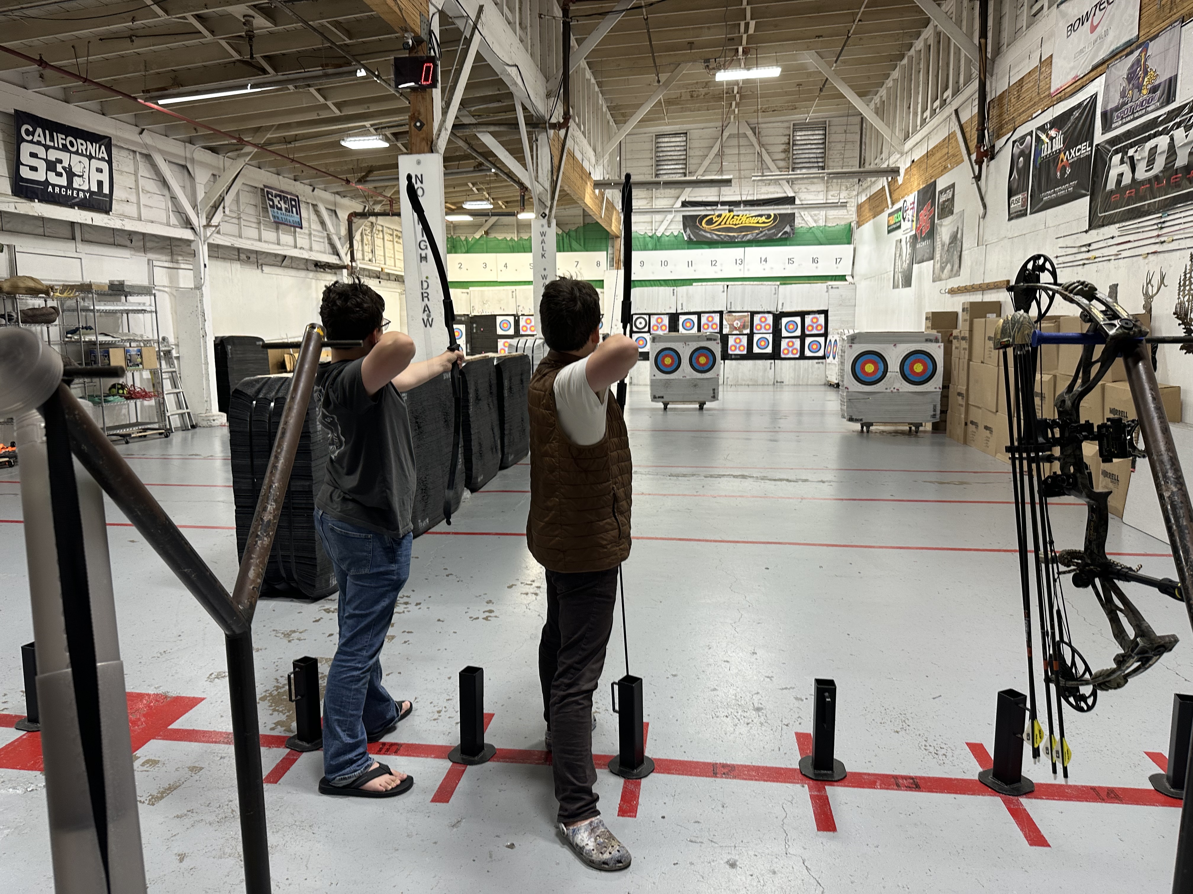 William and Vito Incasa practicing archery