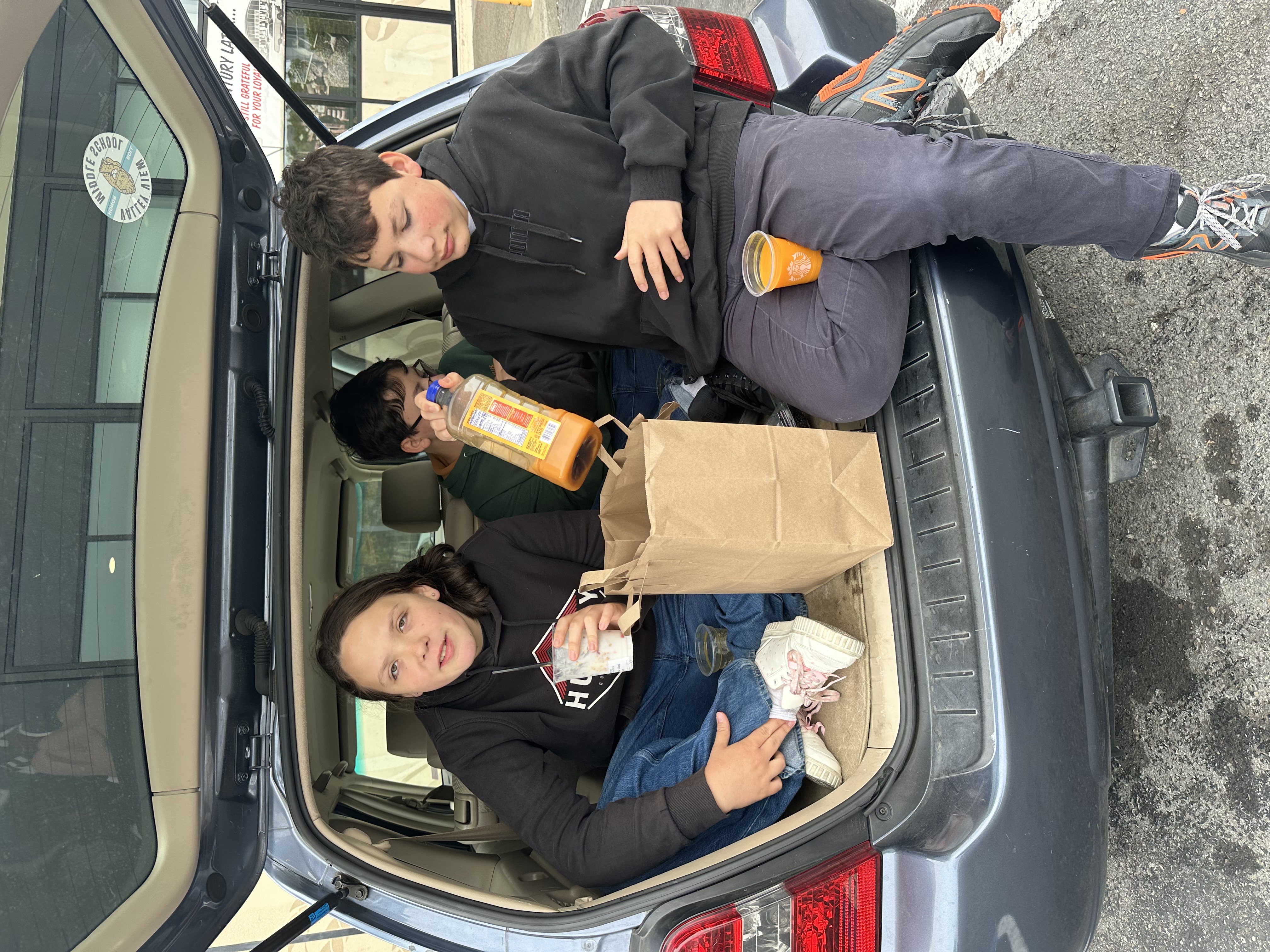 Aisling and William Incasa in the back of the family SUV
