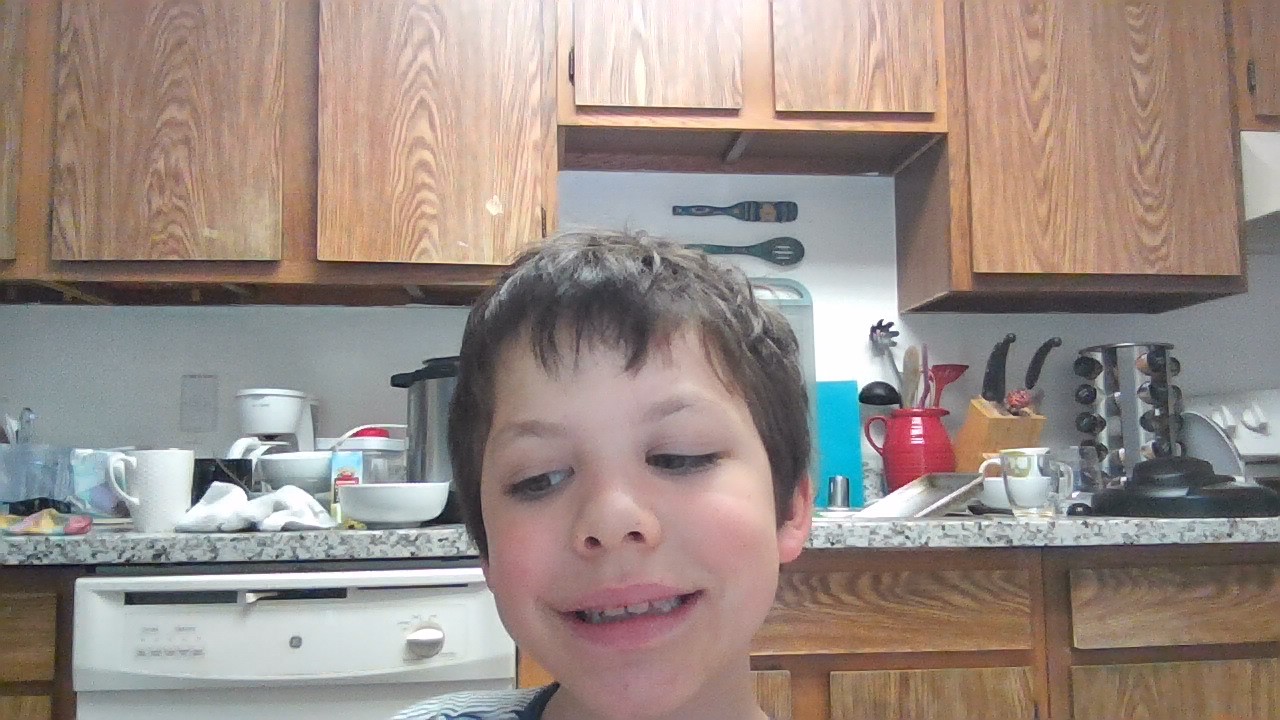 William Incasa smiling in the family kitchen